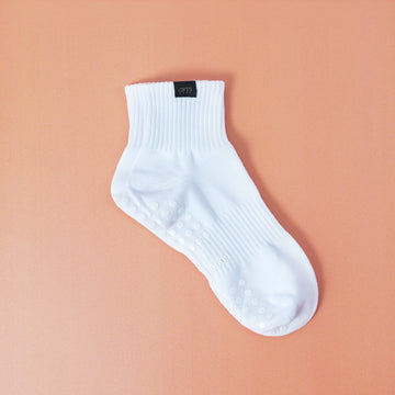 White sock on a peach background
